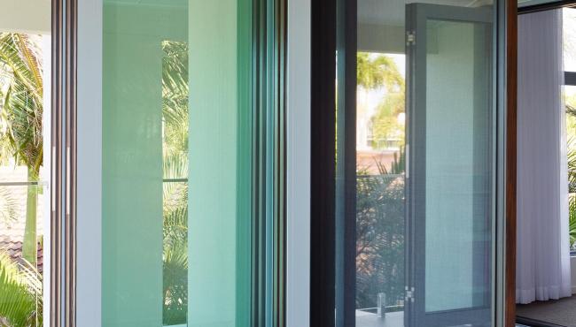 Centor folding patio door with custom retractable fly screen